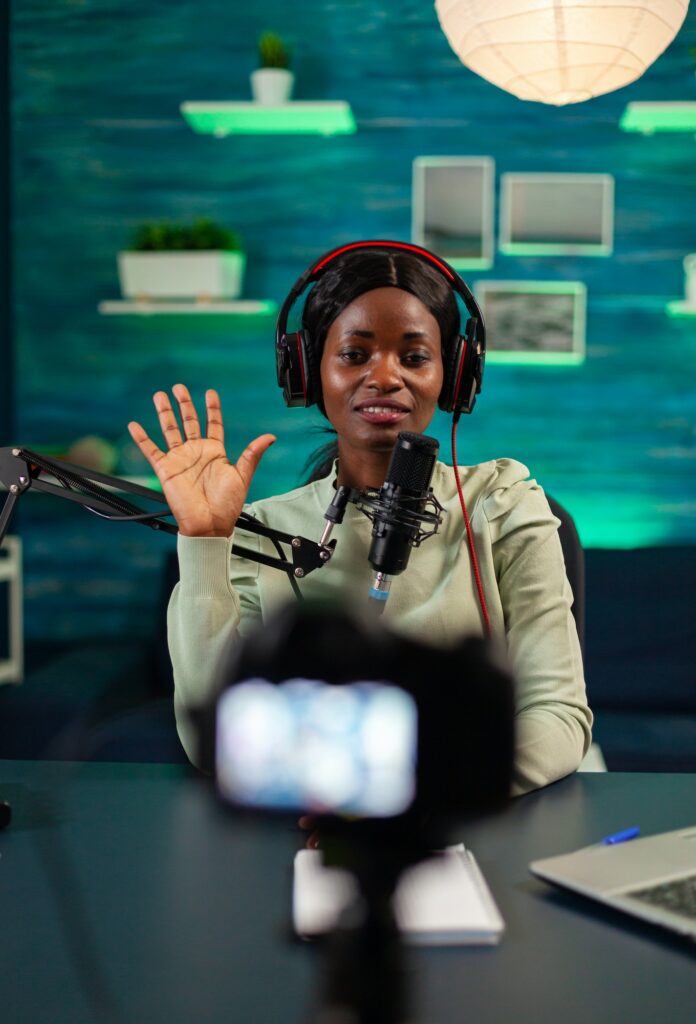 Afro content creator saying hellow to listeners